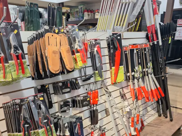 Tidbury Creek Farms store with various landscaping tools and wheelbarrows.